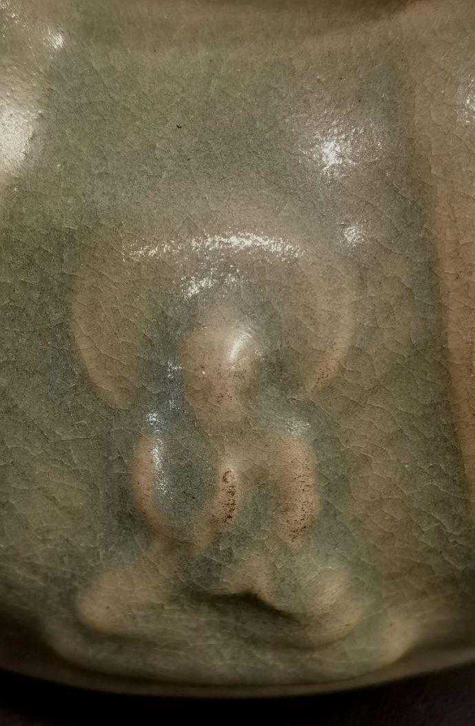 汝窑凤首释迦牟尼佛纹皮囊壶